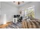 Bright bedroom offers natural light, wood floors and a comfortable beanbag chair at 101 Briargate Look, Ormond Beach, FL 32174