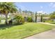 Beautiful single-story home with a well-manicured lawn and lush landscaping at 101 Briargate Look, Ormond Beach, FL 32174