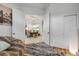 View of dining room from hallway with open doorway and a stylish rug at 101 Briargate Look, Ormond Beach, FL 32174