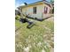 View of the backyard with various household items at 1025 Persian St, Deltona, FL 32725