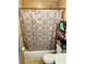 Functional bathroom with updated tiled shower and vanity, ready for everyday use at 1025 Persian St, Deltona, FL 32725