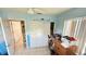 Bright bedroom with ceiling fan and a closet, awaiting personalization at 1025 Persian St, Deltona, FL 32725