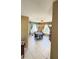Bright dining area features tile flooring, round table, and natural lighting from large windows with patterned curtains at 1025 Persian St, Deltona, FL 32725