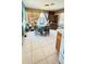 Bright dining area features tile flooring, round table, and natural lighting from large windows with patterned curtains at 1025 Persian St, Deltona, FL 32725