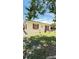 Charming single-story home with red trim, a well-manicured lawn, and mature trees at 1025 Persian St, Deltona, FL 32725
