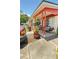 Charming front porch with seating, potted plants, and a welcoming entrance to the home at 1025 Persian St, Deltona, FL 32725