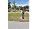 Well-maintained single-story home with a lovely front yard, mailbox, and driveway at 1025 Persian St, Deltona, FL 32725
