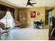 Bright living room featuring tile flooring, a ceiling fan, and plenty of natural light at 1025 Persian St, Deltona, FL 32725