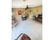 Spacious living room with tile floors, comfortable seating, and abundant natural light at 1025 Persian St, Deltona, FL 32725