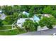 Aerial view of home, detached garage, and manicured yard at 1056 Stevens St, Lake Helen, FL 32744
