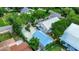 Aerial view of the home showcasing landscaping and the adjacent detached garage at 1056 Stevens St, Lake Helen, FL 32744