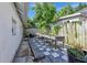 Backyard with raised garden beds, gravel pathway, and modern pavers at 1056 Stevens St, Lake Helen, FL 32744