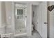 Updated bathroom with marble tiled shower and separate toilet room at 1056 Stevens St, Lake Helen, FL 32744