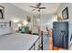 Well-lit bedroom featuring hardwood floors and vintage style furnishings at 1056 Stevens St, Lake Helen, FL 32744