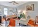 Bedroom with hardwood floors, a bed, a comfy chair, and lots of natural light at 1056 Stevens St, Lake Helen, FL 32744