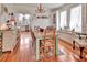 Elegant dining area with natural light, hardwood floors, and stylish decor, creating a perfect space for Gathering meals at 1056 Stevens St, Lake Helen, FL 32744