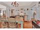 Charming dining area with hardwood floors and cozy seating, ideal for enjoying meals in a relaxed and inviting setting at 1056 Stevens St, Lake Helen, FL 32744