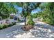 Beautiful home with a well maintained yard, a long driveway, and mature trees, providing privacy and curb appeal at 1056 Stevens St, Lake Helen, FL 32744
