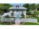 Charming home featuring a white picket fence, stone pathway, and well-manicured lawn at 1056 Stevens St, Lake Helen, FL 32744