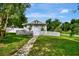 Charming home with a white picket fence and inviting stone pathway at 1056 Stevens St, Lake Helen, FL 32744