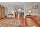 Spacious open floor plan connecting the living room and dining area with hardwood floors at 1056 Stevens St, Lake Helen, FL 32744