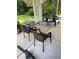 Backyard patio area with chairs and view of the green lawn at 110 Amigos Rd, Debary, FL 32713
