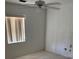 Bedroom with a window and ceiling fan at 110 Amigos Rd, Debary, FL 32713