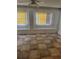 Living room featuring tiled floors, two windows with yellow blinds and white walls at 110 Amigos Rd, Debary, FL 32713