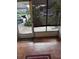 Enclosed patio with tiled floor, glass door, and view of the driveway at 110 Amigos Rd, Debary, FL 32713