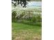 The backyard shows a small deck with railings by the water at 1118 Prescott Blvd, Deltona, FL 32738