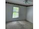 Bedroom with carpeting, a ceiling fan, and a window with blinds at 1118 Prescott Blvd, Deltona, FL 32738