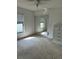 Standard bedroom with a ceiling fan, carpet, and a closet with mirrored doors at 1118 Prescott Blvd, Deltona, FL 32738