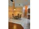 A dining area featuring a table and three chairs and tile flooring at 1118 Prescott Blvd, Deltona, FL 32738