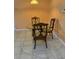 A dining area featuring a table and three chairs at 1118 Prescott Blvd, Deltona, FL 32738
