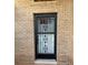 The house features a secure front door with decorative iron bars at 1118 Prescott Blvd, Deltona, FL 32738