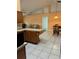 Bright kitchen featuring tile floors and stone countertops at 1118 Prescott Blvd, Deltona, FL 32738