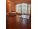 Bright, airy living room with large windows, hardwood floors, and neutral decor at 1118 Prescott Blvd, Deltona, FL 32738