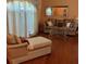 Comfortable living room with hardwood floors, neutral decor, and a cozy chaise lounge at 1118 Prescott Blvd, Deltona, FL 32738