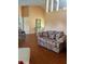 Spacious living room with neutral decor, hardwood floors, and plenty of natural light at 1118 Prescott Blvd, Deltona, FL 32738