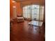 Bright, airy living room with large windows, hardwood floors, and neutral decor at 1118 Prescott Blvd, Deltona, FL 32738