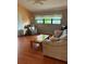 A cozy living room with a sofa, two chairs, and a wooden coffee table at 1118 Prescott Blvd, Deltona, FL 32738