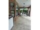 The large screened patio features brick accents and a swing at 1118 Prescott Blvd, Deltona, FL 32738