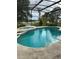 Backyard swimming pool and hot tub combination under screened enclosure at 1118 Prescott Blvd, Deltona, FL 32738