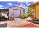 Backyard shed offers storage and functionality, surrounded by potted flowers at 1131 Lemonwood Ave, Deland, FL 32724
