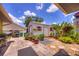Charming backyard showcasing a small shed, landscaping and a tiled patio at 1131 Lemonwood Ave, Deland, FL 32724