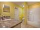 Bathroom featuring a tiled shower-tub combo, toilet, and granite counter with a sink at 1131 Lemonwood Ave, Deland, FL 32724