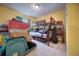 Bedroom with bunk beds, tile floors, and closet space; cluttered with boxes at 1131 Lemonwood Ave, Deland, FL 32724