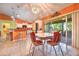 View of the eat-in kitchen and dining space in this open concept home at 1131 Lemonwood Ave, Deland, FL 32724