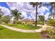Landscaped house with solar panels, a walkway, and lush green lawn at 1131 Lemonwood Ave, Deland, FL 32724