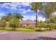 Inviting home with solar panels, mature trees, colorful plants, and well-maintained landscaping at 1131 Lemonwood Ave, Deland, FL 32724